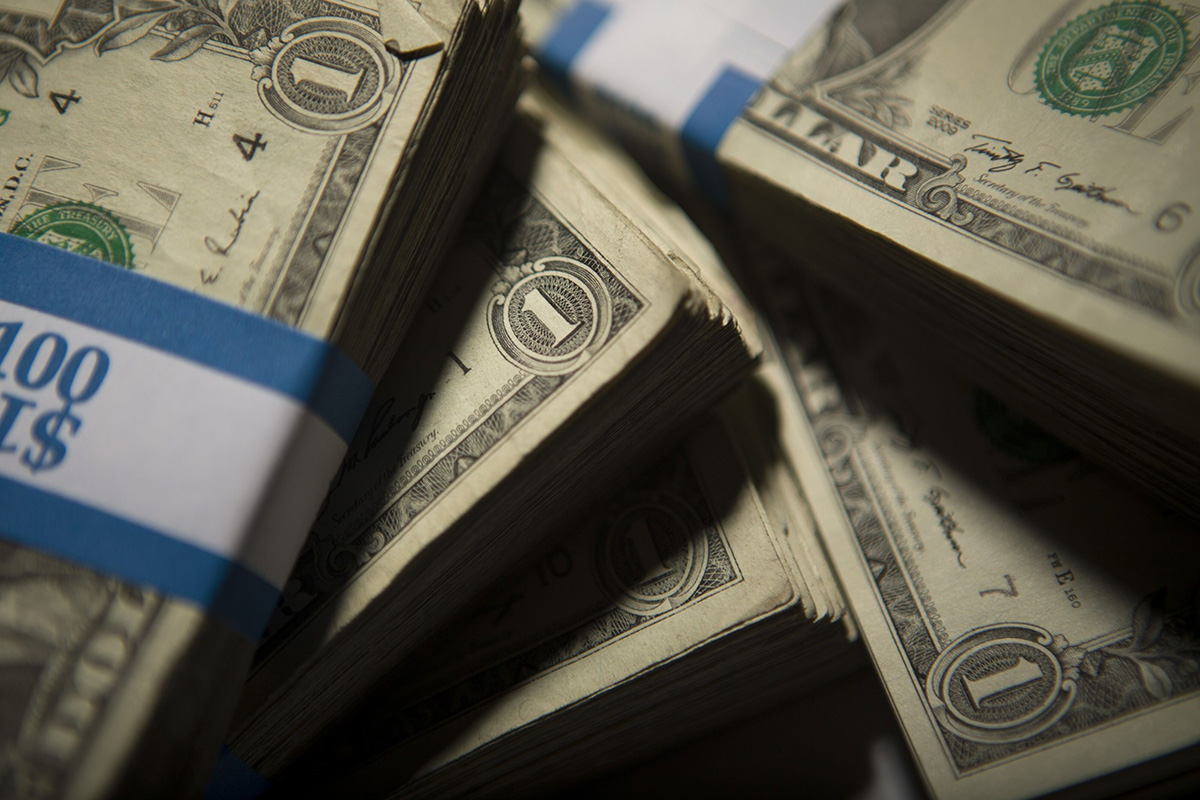 Photo: Stacks of U.S. one-dollar bills. Photographer: Scott Eells/Bloomberg