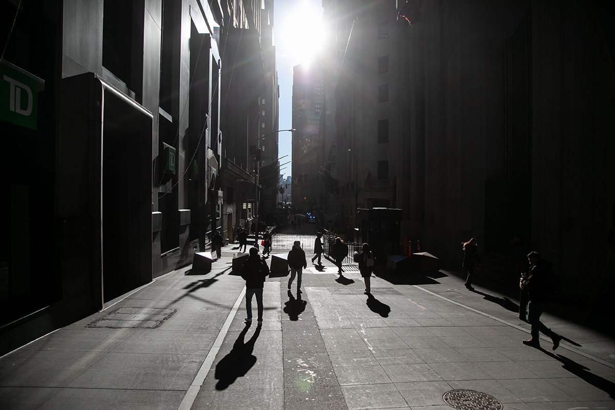 Photo: Pedestrians near New York Stock Exchange (NYSE) in New York.