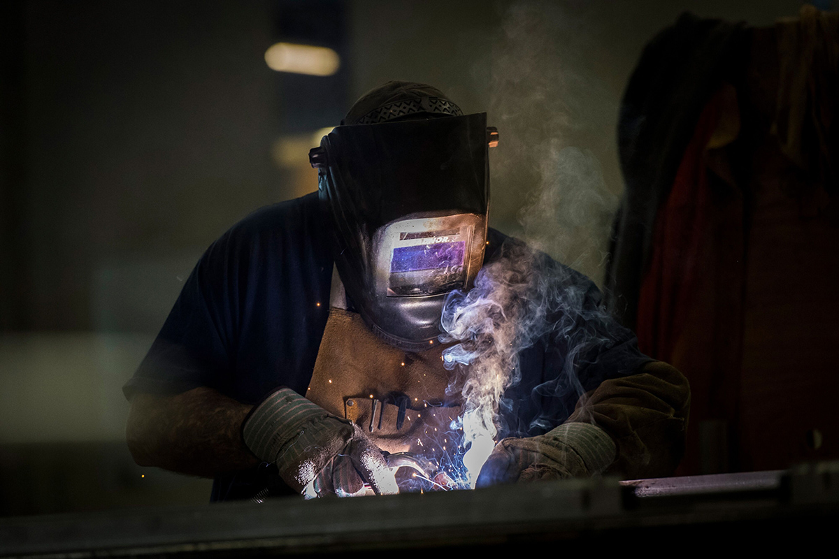 Photo: Employees use a metal inert gas (MIG) welder to weld the seams of metal doors being constructed at the Metal Manufacturing Co. fabrication plant in Sacramento, California, on April 12, 2018. Photographer: David Paul Morris/Bloomberg
