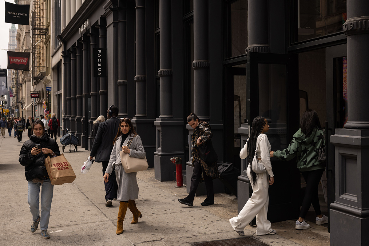 Photo: A shopper carries a MUJI USA bag in the Soho neighborhood of New York City on April 11, 2024.