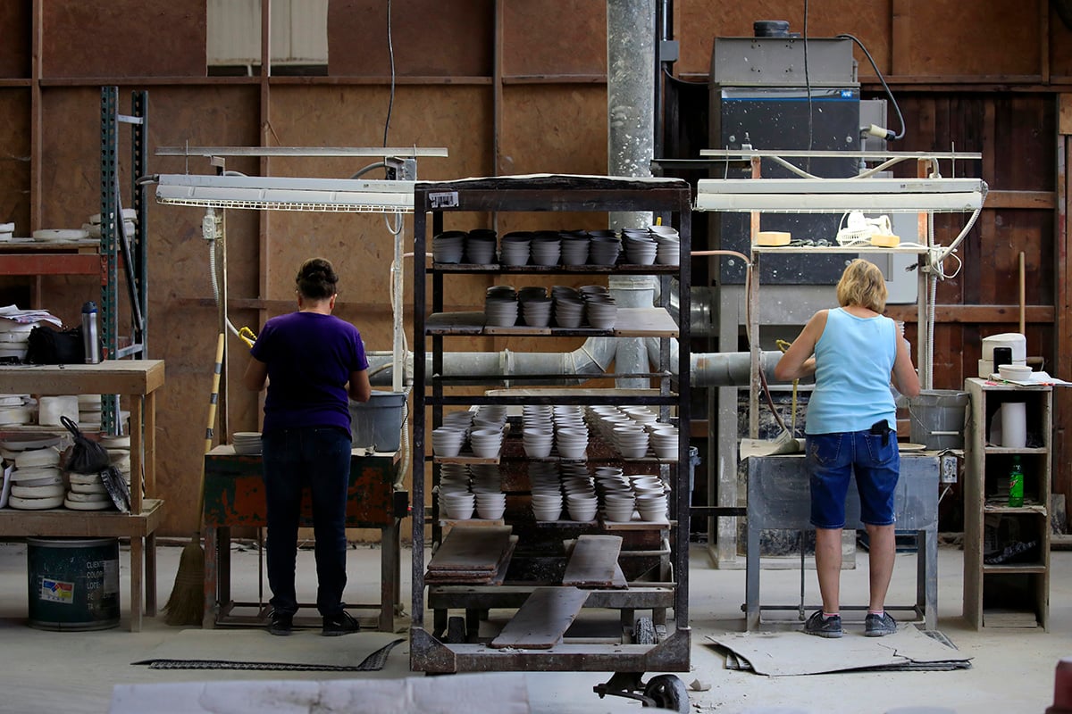 Photo: Workers manufacture dinnerware at the Fiesta Tableware Co. factory in Newell, West Virginia, on July 22, 2021. Photographer: Luke Sharrett/Bloomberg via Getty Images.