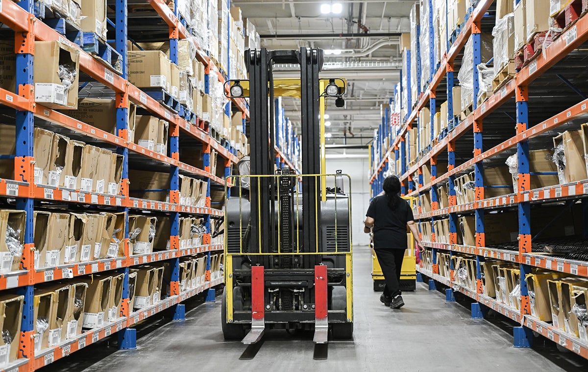 Photo: A worker prepares orders for shipping at la Vie en Rose distribution centre in Montreal, Quebec, on February 27, 2024. Photographer: Graham Hughes/Bloomberg.