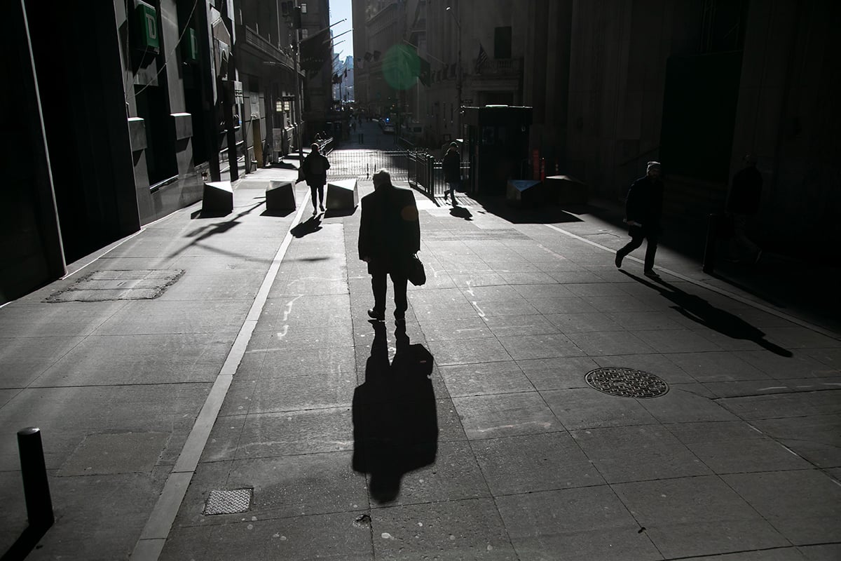 Photo: Pedestrians walk along Wall Street near the New York Stock Exchange (NYSE) in New York City on February 16, 2024. Photographer: Michael Nagle/Bloomberg