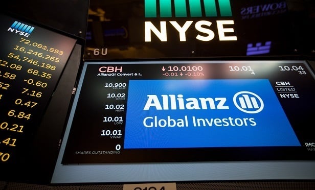 A monitor displays Allianz Global Investors GmbH signage on the floor of the New York Stock Exchange (NYSE) in New York, U.S., on Monday, July 3, 2017. U.S. stocks rose in light trading and the dollar strengthened as factory data bolstered optimism in the strength of the American economy. Crude climbed for an eighth day.