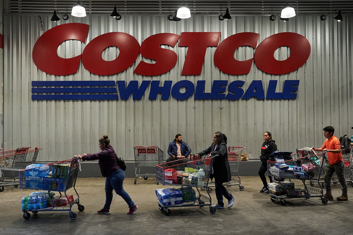 Photo: Shoppers outside a Costco store in New York. Photographer: Bing Guan/Bloomberg