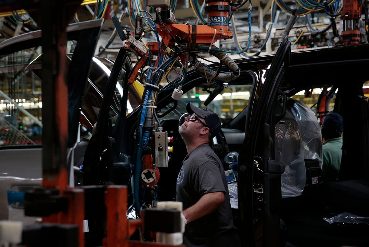 Photo: A worker on the assembly line at the Ford Motor Company's Rouge Complex in Dearborn, Michigan. Photographer: Jeff Kowalsky/AFP/Getty Images