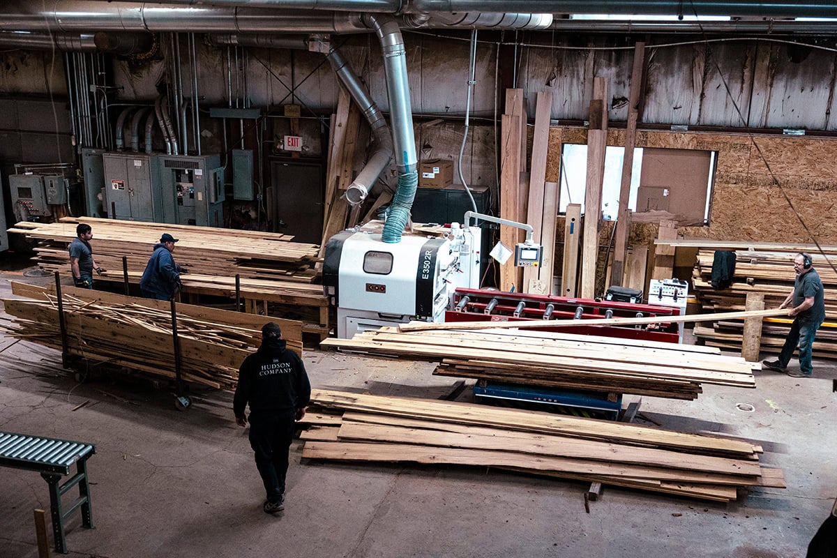 Photo: Workers operate a saw to cut reclaimed wood planks in to flooring at The Hudson Company sawmill in Pine Plains, New York, on April 10, 2024. Photographer: Angus Mordant/Bloomberg.
