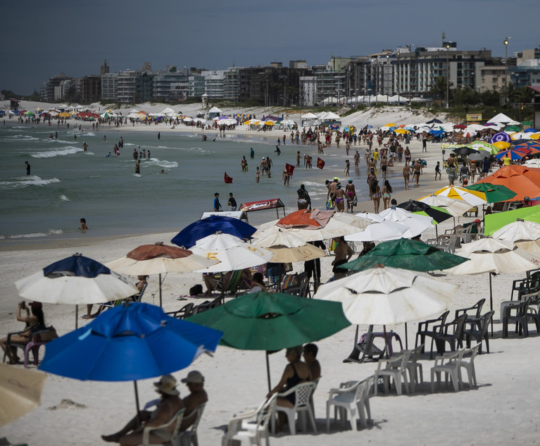 Beachgoers congregate on Fort Beach in Cabo Frio, Brazil, Dec. 15, 2021. Photo by Bruna Prado/AP