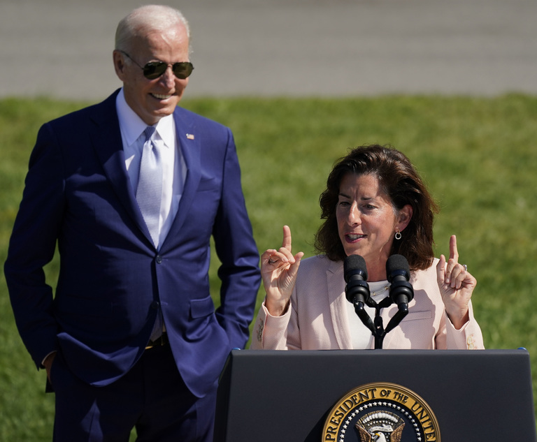 President Joe Biden looks on as Secretary of Commerce Gina Raimondo speaks on the South Lawn of the White House on Aug. 9, 2022. Photo: Carolyn Kaster/AP