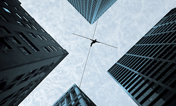 Stock illustration: Tightrope walking between buildings