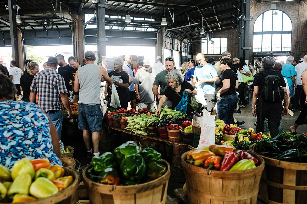 Photo: Customers shop for produce at the Eastern Market in Detroit.