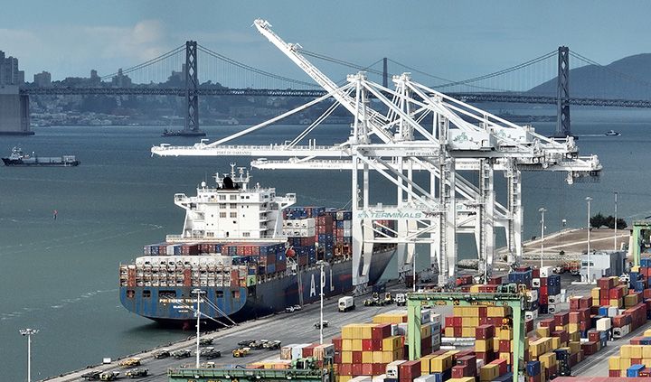 Photo: Cranes sit idle as a container ship sits docked at the Port of Oakland on November 2 in Oakland, California. (Photo by Justin Sullivan/Getty Images)