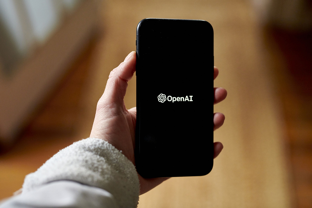 Photo: The OpenAI logo on a smartphone.