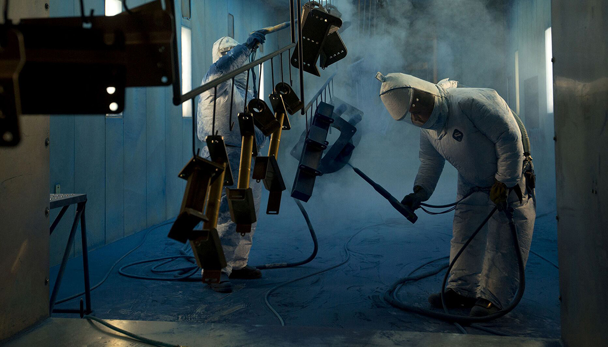 Photo: Workers powder-coat components at a facility in Williamsburg, Iowa. Photographer: Daniel Acker/Bloomberg