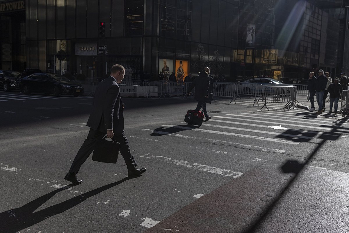 Photo: Pedestrians cross 5th Avenue near Trump Tower in New York on April 3, 2023.