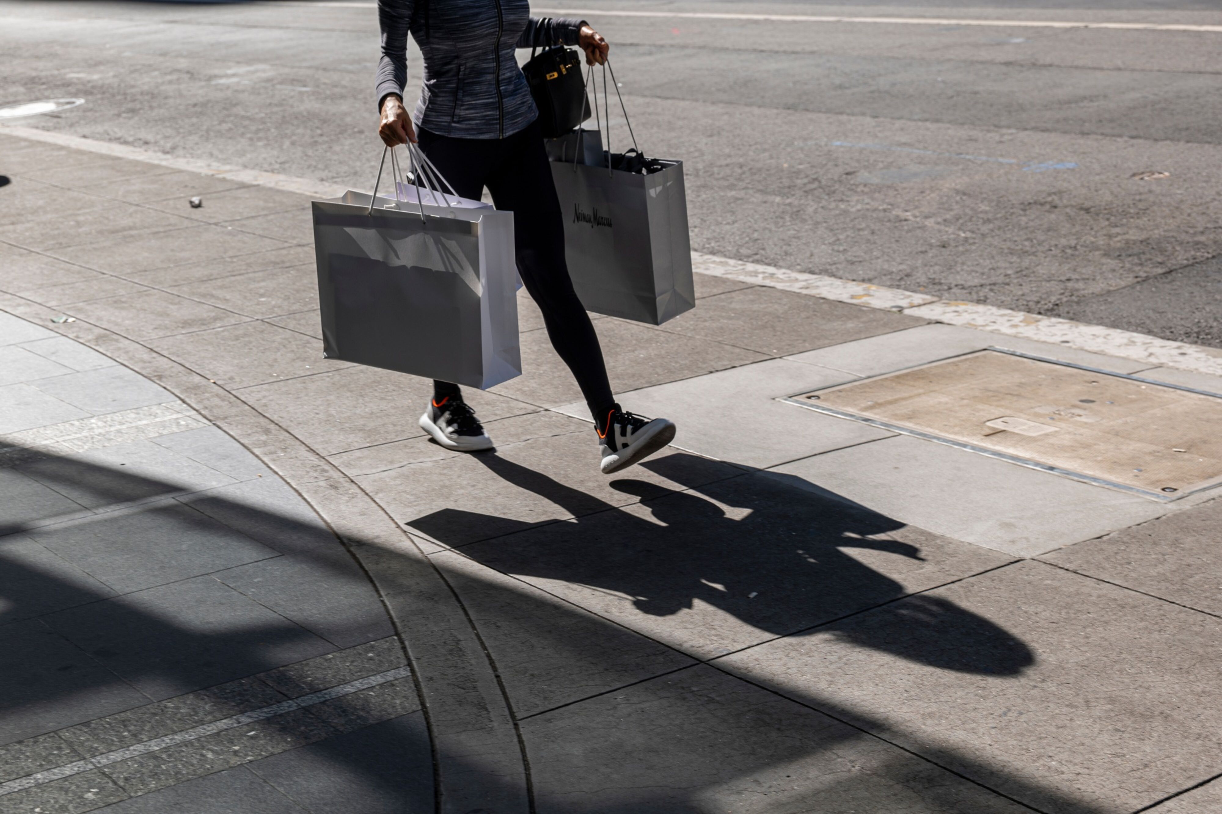 Photo: A pedestrian carries shopping bags in San Francisco, on June 1, 2022. Photographer: David Paul Morris/Bloomberg.