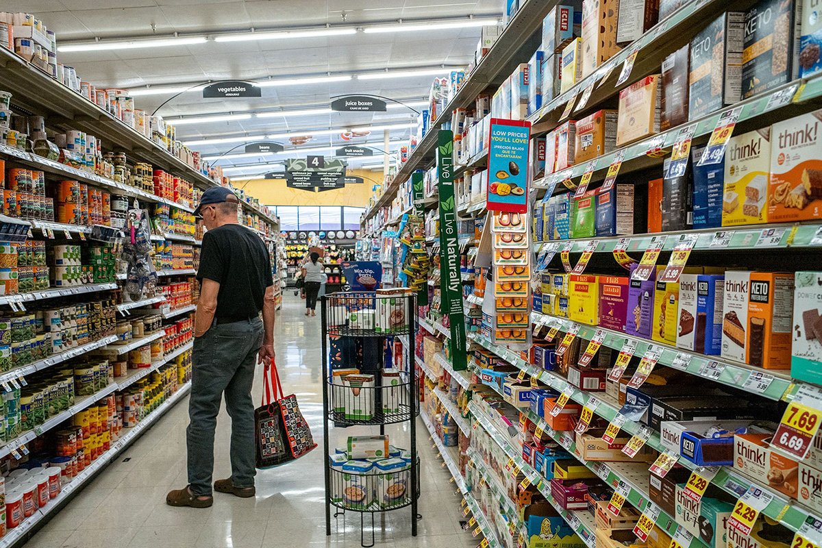 Photo: A customer shops in a grocery store in Houston. Photographer: Brandon Bell/Getty Images