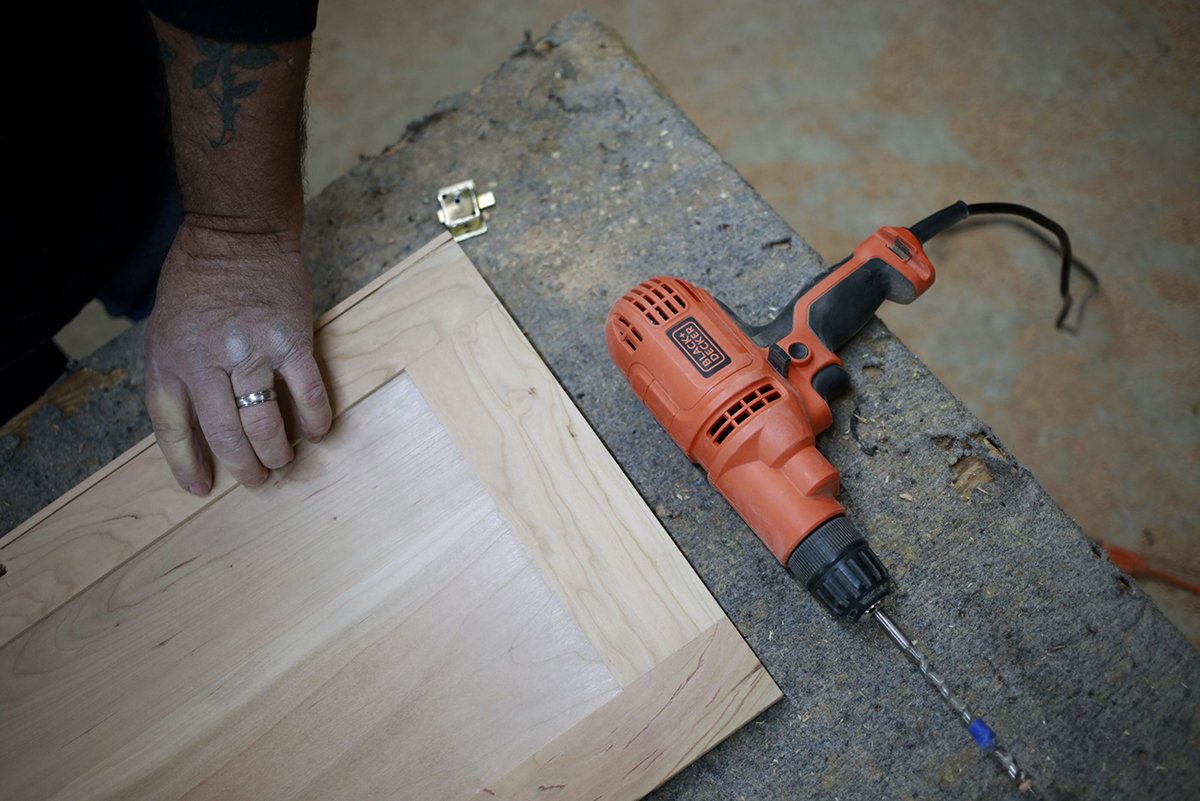 Photo: A worker puts together a cabinet at a wood shop in Auburn, Kentucky. Photographer: Luke Sharrett/Bloomberg