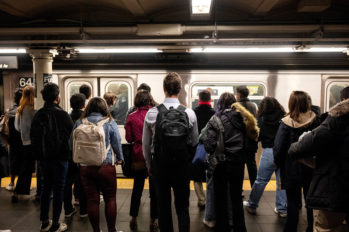 Photo: Commuters at a subway station in New York. Photographer: Victor J. Blue/Bloomberg.