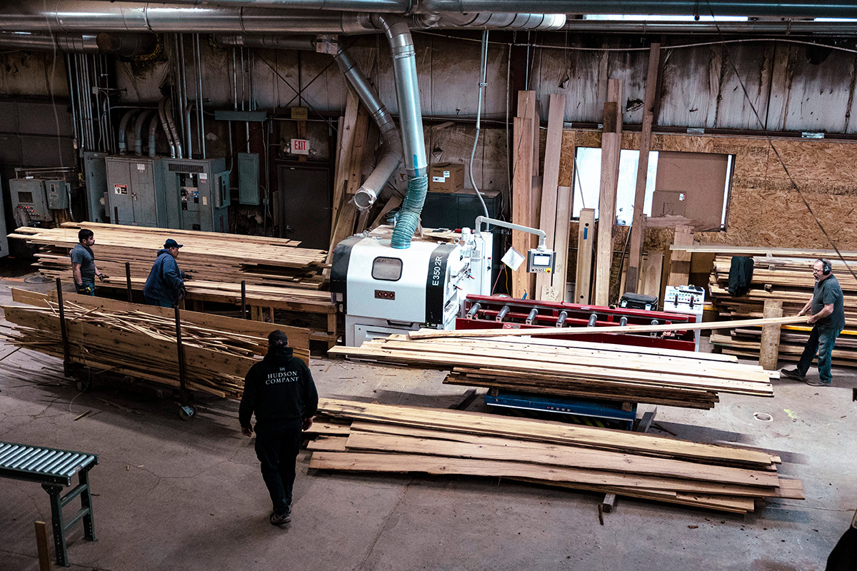 Photo: Workers operate a saw to cut reclaimed wood planks in to flooring at The Hudson Company sawmill in Pine Plains, New York, on April 10, 2024. Photographer: Angus Mordant/Bloomberg.