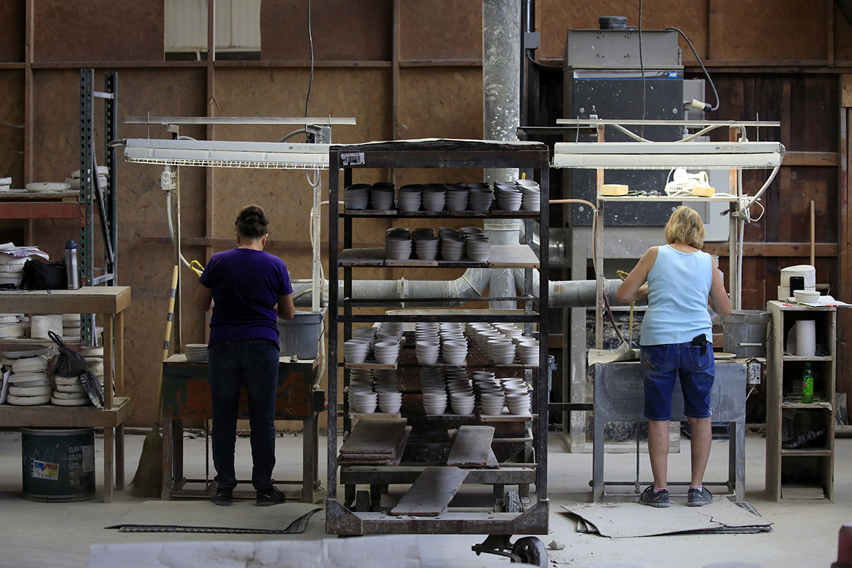 Photo: Workers manufacture dinnerware at the Fiesta Tableware Co. factory in Newell, West Virginia, on July 22, 2021. Photographer: Luke Sharrett/Bloomberg via Getty Images.