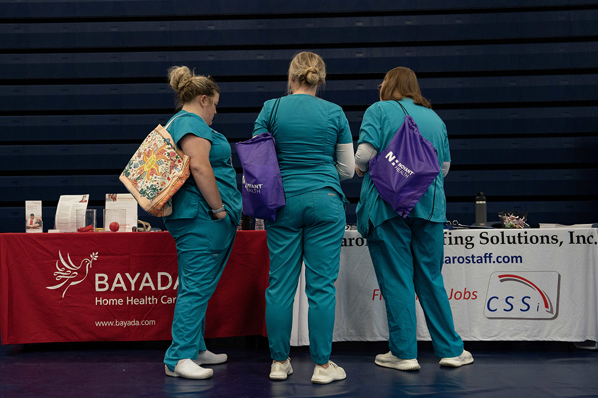 Photo: Attendees at a career fair at a community college in Bolivia, North Carolina. Photographer: Allison Joyce/Bloomberg.