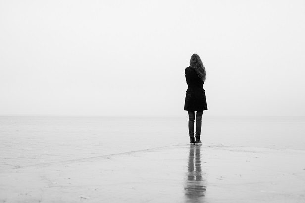 Stock photo: a woman alone on a beach