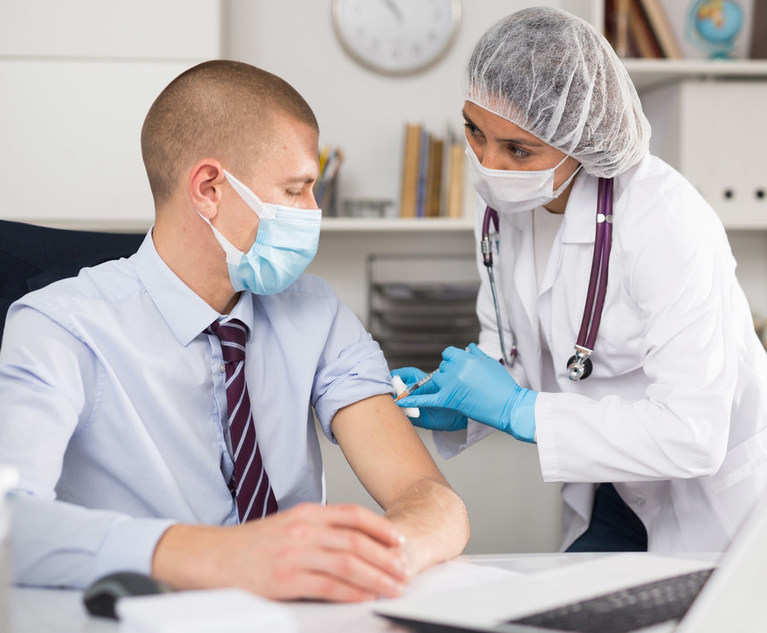 Man getting covid vaccinne from healthcare professional